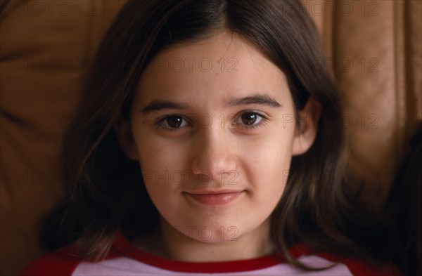 CHILDREN, Girls, Single, Portrait of smiling girl aged eleven with brown eyes and hair.