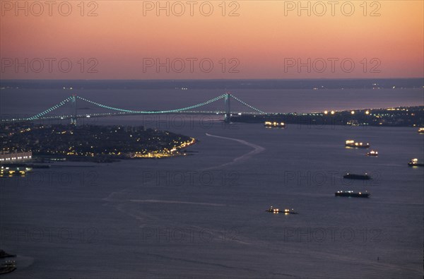 USA, New York State, New York, Aerial view of the sea approaches to the city and the Verrazano Narrows Bridge at night.