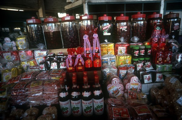 VIETNAM, Dalat, Market stall display of various products made from strawberries.