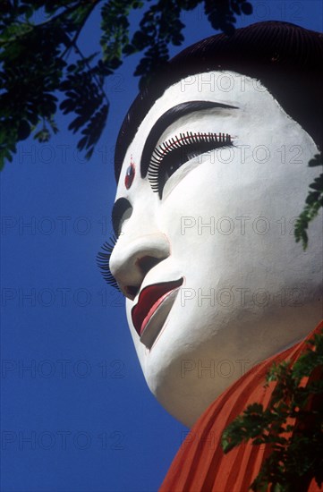 MYANMAR, Pegu, "Detail of white face of Buddha statue in threequarter profile left, viewed from below."