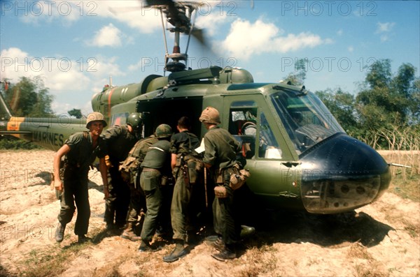 VIETNAM, War, Booby trap marine dust off North of Tam Ky.  Wounded soldier being lifted into helicopter.
