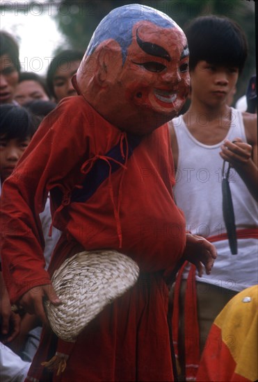 VIETNAM, Ho Chi Minh City , "Dancer in carnival head at Ton San village, celebrating Tet Nguyen Dan, the Vietnamese New Year."