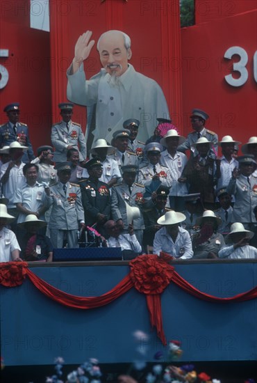 VIETNAM, Ho Chi Minh City, Liberation of Saigon 10th Anniversary celebration.  Generals gathered in front of a poster of Ho Chi Minh.