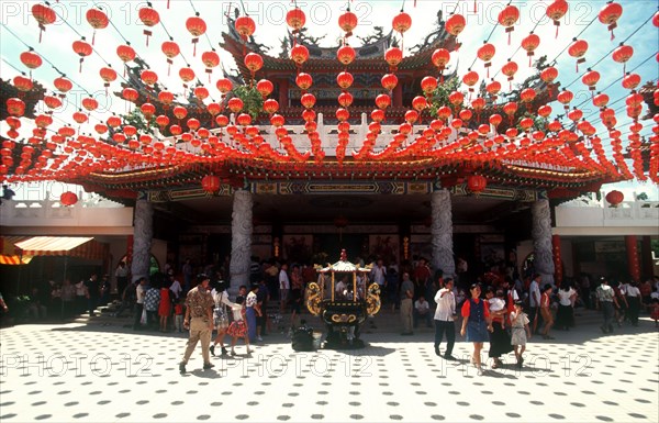 MALAYSIA, Kuala Lumpur, "Thean Hou Temple, entrance with crowds of visitors and strings of coloured lanterns."