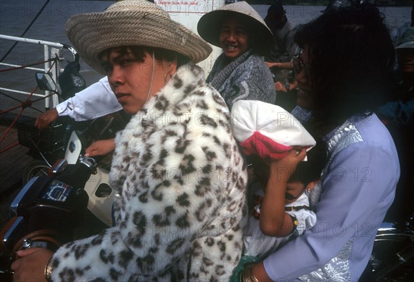VIETNAM, South, Ben Tre, Passengers sitting on motorbikes on a Mekong ferry