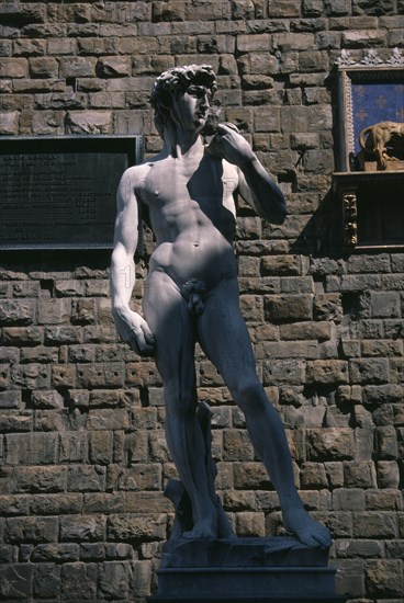 ITALY, Tuscany, Florence, One of the copies of David by Michelangelo in front of the Palazzo Vecchio in the Piazza della Signoria