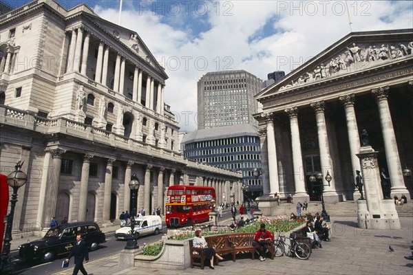ENGLAND, London, The Royal Exchange and Bank of England buildings.  Exterior view with people and traffic in the foreground.