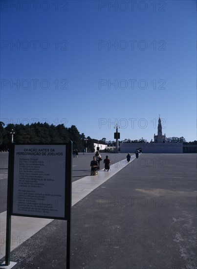 PORTUGAL, Beira Litoral, Fatima, Pilgrims approaching shrine on their knees whilst praying
