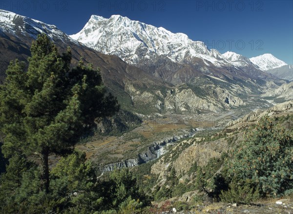NEPAL, Annapurna Region, Gangapurna Mountain, Snow topped mountain peak above the Marsyangdi River Valley.