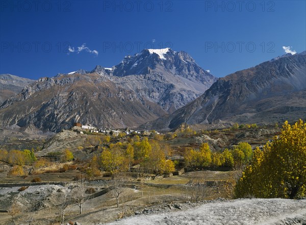 NEPAL, Annapurna Region, Jharkot, View over Jhong Khola Valley and the Thorung La pass to distant fortress town and Yakawa Kang mountain.