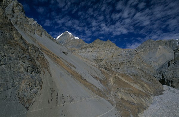 NEPAL, Annapurna Region, View over mountain landscape around the Jhargeng khola river valley and Phedi with the snow capped peak of Yakawa Kang Mountain in the distance.