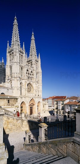 SPAIN, Castilla Y Leon , Burgos Province, Cathedral.  View from flight of stone steps in the foreground towards gothic facade and twin spires.