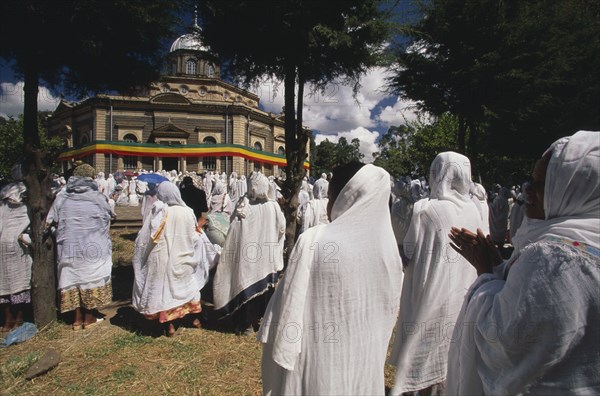 ETHIOPIA, Addis Ababa, "St George Church, Kidus Giorgis, the principle church in Addis Ababa draped in the colours of the national flag.  Large group of people gathered to attend ceremony."