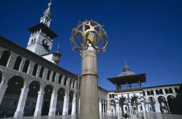 SYRIA, South, Damascus, "The Umayyad Mosque.  Lantern holder with ablutions fountain, Minaret of the Bride and arcade in the background."
