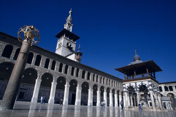 SYRIA, South, Damascus, "The Umayyad Mosque.  Lantern holder with ablutions fountain, Minaret of the Bride and arcade."