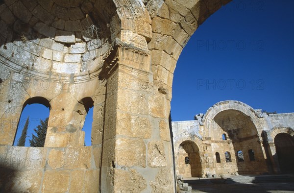 SYRIA, North, Qalaat Samaan, Church of Saint Simeon.  Detail of limestone archway and wall recess.