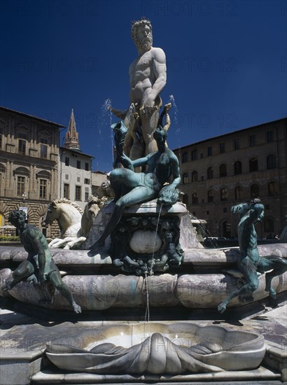ITALY, Tuscany, Florence, "Piazza della Signoria.  Fontana di Nettuno, fountain designed by Ammannati in 1575 depicting the Roman sea god surrounded by water nymphs."