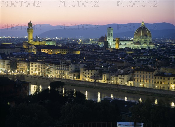 ITALY, Tuscany, Florence, View over city at dusk with the Duomo illuminated and street lights reflected in the River Arno.