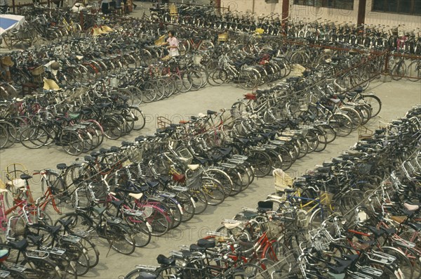 CHINA, Henan, Kaifeng, Massed cycles in bicycle park