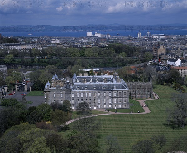 SCOTLAND, Lothian, Edinburgh, "Holyrood Palace, the Queens official Scottish residence.  Exterior view from Salisbury Craggs with city behind."