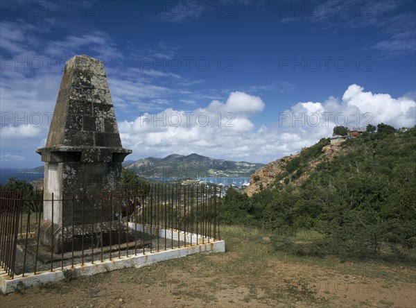 WEST INDIES, Antigua, Shirley Heights, "Memorial to members of the Dorset Regiment who died in the 1940s, surrounded by railings with view towards Falmouth and English Harbour behind. "