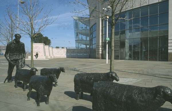 IRELAND, North, Belfast, "Shepherd and Sheep sculpture by artist Deborah Brown, in the grounds of the Waterfront Hall Lanyon Place"