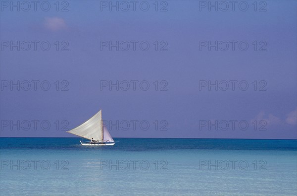 PHILIPPINES, Boracay, Sailboat offshore in clear water