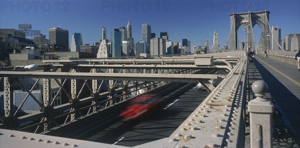 USA, New York State, New York, Lower Manhattan.  Post September 11 skyline from Brooklyn Bridge with traffic and pedestrians crossing.