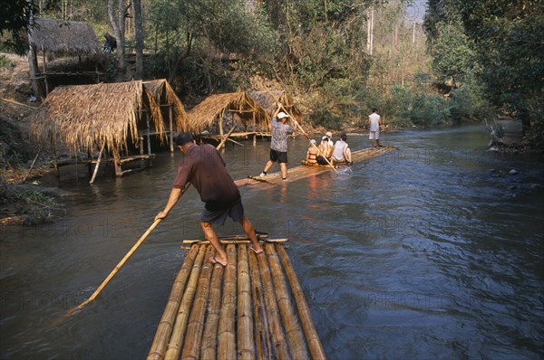 THAILAND, North, Chiang Mai, Tourists rafting through the jungle south of Chiang Mai