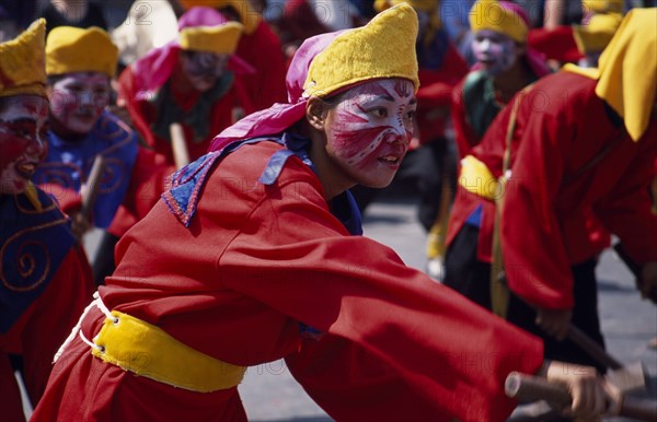 THAILAND, North, Chiang Mai, An accompanying performer in the Dragon dance at the end of Chinese New Year in Chinatown