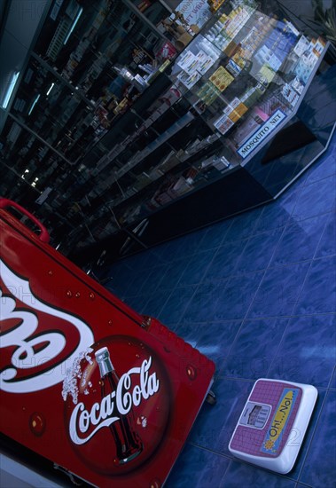 THAILAND, North, Chiang Mai, Pharmacy with Coca Cola fridge and scales on the step  with the words Oh No written on it