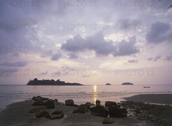 THAILAND, Trat Province, Koh Chang, "Kai Bae Beach view of sunset over Koh Man Nai, Koh Man Nok and Koh Pli Islands."