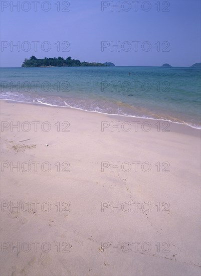 THAILAND, Trat Province, Koh Chang, "Lonley Beach, Aow Bai Lan. View out toward small island from sandy shore."