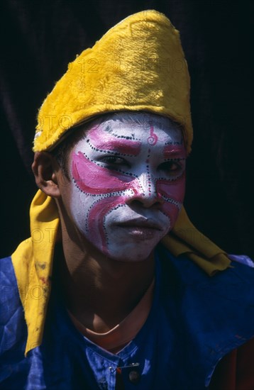THAILAND, North, Chiang Mai, Chinese New Year.  Young boy wearing costume and face paints during procession.