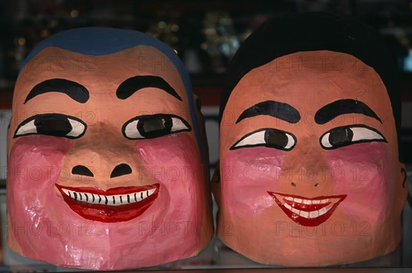 THAILAND, North, Chiang Mai, Chinese New Year.  Close view of two character masks worn during Dragon Dance.