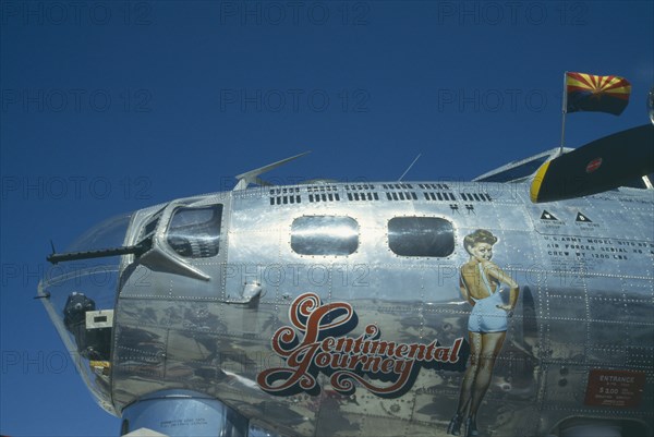 TRANSPORT, Air, Old Non-Fighter, US Army plane now Sentimental Journey exhibit.  Detail of exterior with painting of wartime pin-up Betty Grable.