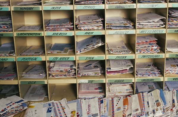 AUSTRALIA, New South Wales, Sydney, Dead letter office at Australia Post with airmail post sorted by country.