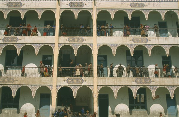 CHINA, Xinjiang Province, Kashgar, Uygur schoolchildren on balconies of multi-storey building.