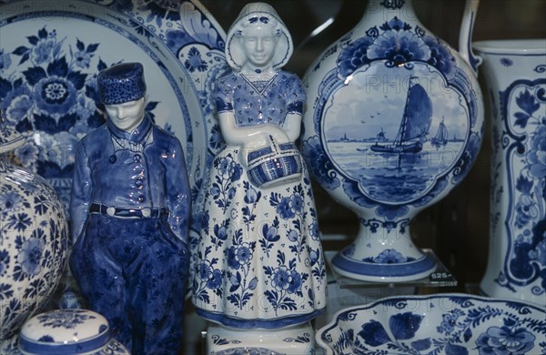 HOLLAND, Zuid Holland, Delft, Close up view of a display of delftware in a shop called De Porceleyne Fles.