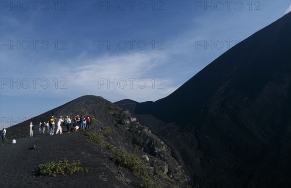 GUATEMALA, Pacaya Volcano, "View of people hiking up an ash path to the summit, stopped to take pictures."