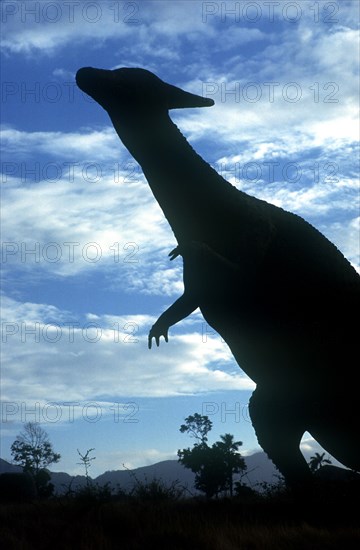 CUBA, Santiago de Cuba, Baccanao, Life size dinosaur silhouetted in amusement park