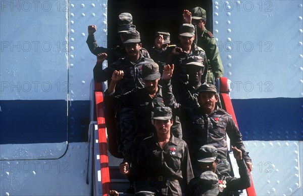 CUBA, Military, Waving soldiers returning from Angola walking down the gangway from a ship