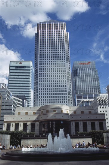ENGLAND, London, "Canary Wharf, view looking up at the tower and surrounding architecture with fountain in the foreground"