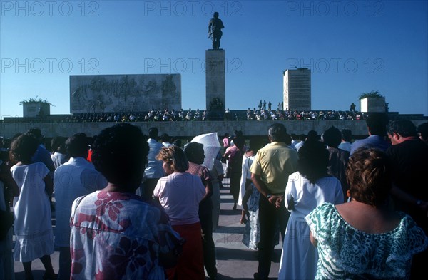 CUBA, Villa Clara, Santa Clara, Memorial Day crowds below a towering statue of Che Guevara at the battle site memorial