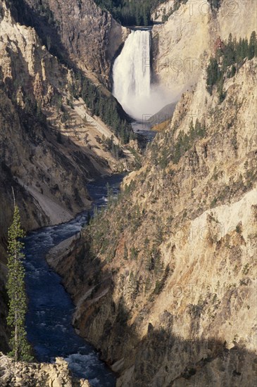 USA, Wyoming, Yellowstone National Park, Grand Canyon of  Yellowstone with waterfall cascading into river below
