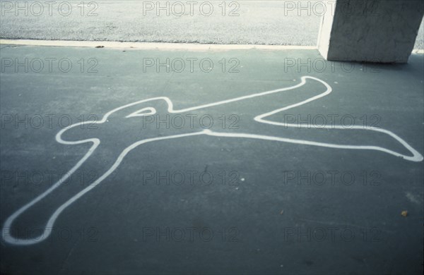 USA, Florida, Painted outline of murder victim on sidewalk pavement