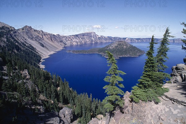 USA, Oregon, Crater Lake National Park, View over water filled crater formed after the erruption of Mount Mazama with small island in the middle