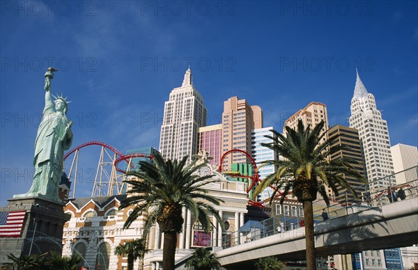 USA, Nevada, Las Vegas, New York New York hotel and casino exterior with scale models of NYC skyline and elevated walkway from MGM Grand