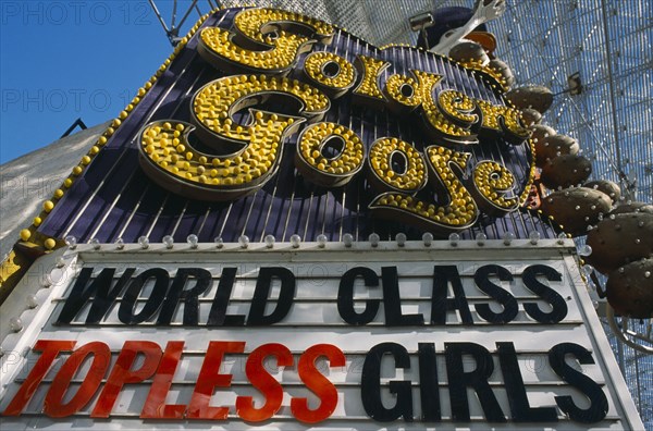 USA, Nevada, Las Vegas, Golden Goose strip joint ‘ Topless Girls ‘ sign in Fremont street covered downtown area