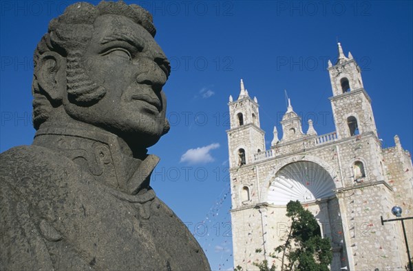 MEXICO, Yucatan, Mérida, Angled view of the Church of San Cristobal facade with head of statue of Don Ignacio de Allende in the foreground.